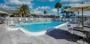 pool with shaded seating areas