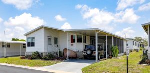 street view of a home with car parked